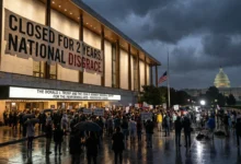 Kennedy Center building in Washington D.C. with a large banner reading 'Closed for 2 Years', surrounded by protesters and news crews during a gloomy evening. Capitol building visible in the background.