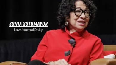 A close-up portrait photograph of Supreme Court Justice Sonia Sotomayor, wearing a striking bright red jacket with unique large buttons and black-framed glasses, smiling and gesturing while speaking. Text overlay reads "SONIA SOTOMAYOR LawJournalDaily".
